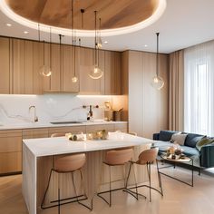 a modern kitchen and living room with wood paneled walls, white counter tops, and bar stools