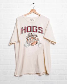 Get ready to cheer on the Hoop Hogs in style with our Hoop Fan Razorbacks Basketball Thrifted Tee! This oversized and unisex fit tee is made from preshrunk cotton and features a vintage inspired design. Each piece is one of a kind, adding a unique touch to your wardrobe. Pair it with vintage denim and your favorite kicks for a winning look. Go Hogs! The Deets: Fit: unisex & oversized Material: Brand: LivyLu Measurements: Model: is wearing a small Thrifted Tees, Razorback Shirt, Men Workwear, Button Outfit, Plus Size Pants, Vintage Inspired Design, Boots For Sale, Matching Dresses, Denim Pant