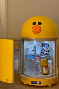 a yellow ducky shaped refrigerator with drinks in it's door and food inside