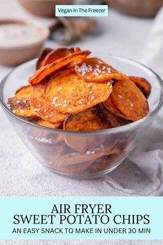 a bowl filled with sweet potato chips on top of a table