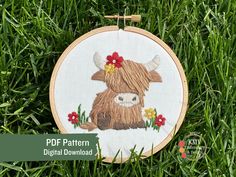 a cross stitch pattern with a highland cow on it