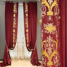 red and gold curtains hanging in front of a window