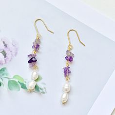 🍀 Size: 1.5 x 5.7 cm 🍀 Material: Amethyst, Freshwater Pearl, 14K Gold Plated Brass Hook Description 🌸 These earrings combine the timeless beauty of freshwater pearls with the boho charm of natural stone drops, creating a captivating and unique design that will elevate any outfit. The pearls and stones are delicately suspended from a dainty chain, allowing them to sway gently as you move, adding a touch of movement and allure to your look. Please note that freshwater pearls and natural stones are naturally unique and may exhibit slight variations in size, shape, and colour. 🌸 ⭐️ Shop more styles at https://etsy.com/uk/shop/StrawberryAtoll.  ⭐️ * Shipping *  🇬🇧 Free shipping for UK orders. All our items will be shipped within 1-2 days.  * Packaging & Gift Wrap * 🎀 All our products are Purple Dangle Bridal Earrings, Purple Pearl Earrings Gift, Purple Pearl Earrings As Gift, Purple Dainty Earrings With Ear Wire, Purple Pearl Earrings For Gift, Dainty Purple Earrings With Ear Wire, Purple Pearl Earrings For Pierced Ears As A Gift, Purple Drop Bridal Earrings As Gift, Purple Dangle Pearl Earrings As Gift