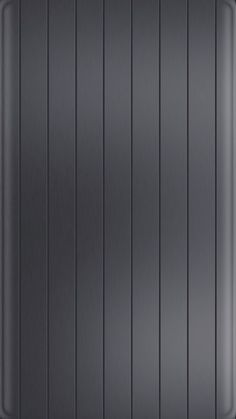 a black metal plate with vertical lines on it