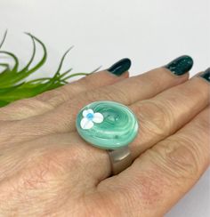 A Murano glass ring top handmade by me. The ring top has the dimensions of 22 x 22 x 7 mm. The ring top can be screwed onto a ring. I melted down a thread in the ring top. Only the ring top is included in the offer. The ring (ring rail) does not. You can order the ring separately here in the shop. All my glass beads are unique and are lovingly handmade by me, handmade on my two-gas burner and then cooled for a long life in a digitally controlled oven.  The holes of the glass beads are all proper Handmade Green Rings With Recycled Glass, Adjustable Hand Painted Round Rings, Green Flower Ring Gift, Handmade Round Jewelry From Recycled Glass, Handmade Green Flower Ring, Handmade Green Flower Ring For Gift, Handmade Glass Rings For Gift, Handmade Adjustable Green Flower Ring, Adjustable Green Flower Ring Gift