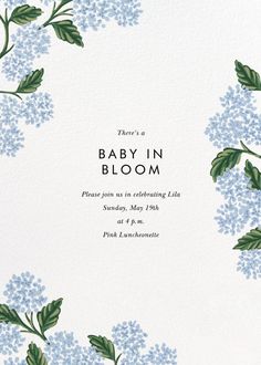 a baby in bloom card with blue flowers