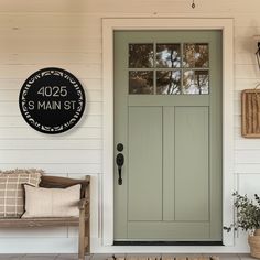 the front door to a house with a sign on it that reads, 4202 main st