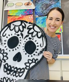 Art teach holding an oversized black and white painted cut-out of an oversized sugar skull art project. Adapted Art, Sugar Skull Crafts, Teacher Collaboration, High School Art Teacher, Skulls Art, Skull Crafts, October Art, Fall Art Projects, Day Of The Dead Art