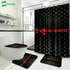 the bathroom is decorated in black and white with red bows on the shower curtain, toilet seat covers and rugs