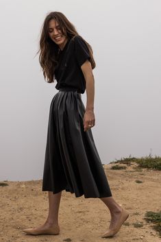 THE APOLLO Midi Length Skirt Take a step back in time with our midi length APOLLO skirt in a vegan leather that will age beautifully. This high-waisted swinging skirt features inset pockets, and a side zipper with button tab closures. Fabric: Vegan Leather Care : Dry Clean Made in California Model is 5'9 and wearing size S Take A Step Back, Midi Length Skirts, Aging Beautifully, Back In Time, Leather Care, Made In America, In America, Midi Length, Side Zipper