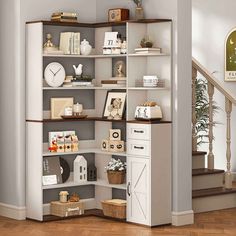 an open bookcase in the corner of a room with stairs and clock on the wall