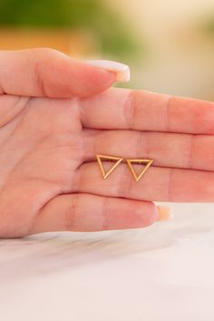 "✦Tiny Gold Triangle Earrings CHARM--DIMENSIONS ✦Each size of the triangle is 0.41\"(approx. 1.04cm) and 0.048\"(approx.0.12cm) thick. MATERIALS ✦Available in Yellow Gold,Rose Gold or White Gold and also in 9K,14K solid gold. ✦Earrings will be shipped in a jewelry box and bag. ✦IMPORTANT NOTE! All import duties and taxes are the buyer's responsibility, this is not calculated in the price. ✦We ship worldwide with FeDex,so please message us with your telephone number. R E T U R N S ✦All jewelry mu Modern Tiny Earrings For Gift, Tiny Modern Earrings For Gift, Tiny Modern Gold Earrings, Minimalist Yellow Gold Earrings For Gift, Minimalist Triangle Jewelry For Anniversary, Gold Triangle Jewelry For Anniversary, 14k Gold Triangle Jewelry In Gold Color, 14k Gold Triangle Jewelry, 14k Gold Triangle Shaped Jewelry