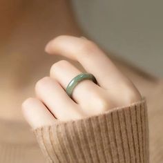 Introducing our exquisite Creative and Minimalist Natural Jade Ring, a truly unique piece of jewelry that embodies contemporary design Handcrafted to ensure each piece is one-of-a-kind, this sterling silver ring is the perfect statement accessory for both men and women. Made with premium quality jade, its minimalist styling adds a touch of sophistication to any outfit, making it suitable for both formal occasions and everyday wear. With its versatile design, this ring is a great alternative to traditional jewelry and is sure to impress. Surprise your loved one with a personalized and timeless gift they can cherish forever. Choose from a range of sizes to find the perfect fit. Elevate any occasion with the beauty of our Creative and Minimalist Natural Jade Ring. Jade Rings, Jade Crystal, Jade Bangle, Jade Ring, Jade Jewelry, Timeless Gifts, Natural Jade, Traditional Jewelry, American Express