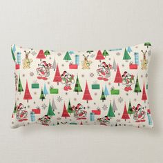 a white pillow with mickey mouse and christmas trees