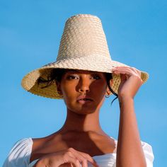 KEMALA is a very special piece designed with beautiful sunny summer days in mind. This piece should be an essential part of any outfit, especially for every island getaway. Crafted from lightweight natural palm straw, KEMALA hat has a high crown and wide down-turned brim to safely protect from the sun’s harsh rays.  DETAILS Composition: 100% Natural Palm Straw Made in Bali, Indonesia Spot clean Adjustable Natural Panama Hat For Poolside, Summer Style Natural Color Sun Hat For Vacation, Summer Style Natural Sun Hat For Vacation, Natural Color Sun Hat For Warm Weather Beachwear, Natural Color Summer Sun Hat For Vacation, Natural Color Sun Hat For Warm Weather, Summer Vacation Natural Sun Hat, Natural Straw Hat For Beachwear, Natural Straw Hat For Beach Vacation