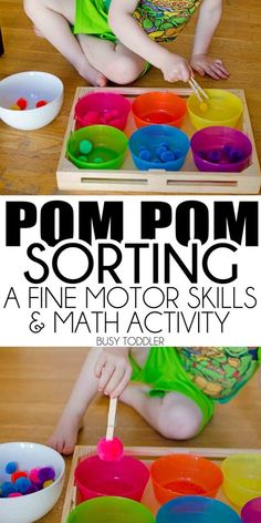 a young child is playing with some sort of activity that includes pom pom sorting and fine motor skills