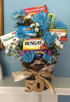 a vase filled with blue flowers and chocolates