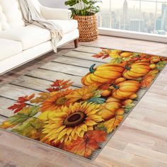 a living room area rug with sunflowers, pumpkins and leaves on it