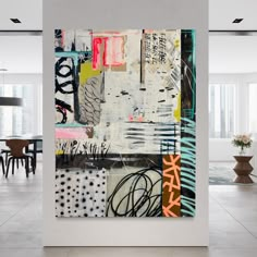 an abstract painting is displayed in the middle of a room with white walls and flooring