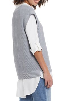 The hottest trend this season is a sweater vest over a long sleeve shirt. Our Silvia sweater vest in grey mix is the perfect style to show off this trend! V-neck, wide band hem and cap sleeve design gives this sweater vest ultimate flair. Layer over our WYLER WHITE ROLL UP SLEEVE SHIRT (pictured) for the perfect trendsetting look! Final Sale- No returns or exchanges. Color- Grey mix. V-neck design. Wide band hem. Cap sleeves. Fabric- 60% Cotton. 40% Acrylic. Care-Hand wash separately in cold. Do Long Grey Sweater, Grey Sweater Vest, Long Sweater Vest, White Collared Shirt, Roll Up Sleeves, Wide Bands, Hottest Trends, Sleeve Designs, Long Sweaters