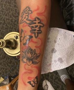 a person with a tattoo on their arm