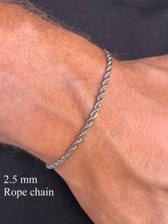 Stainless Steel Rope Chain in Silver Tone. Elevate your style with our men's silver-tone stainless steel chain bracelet. Crafted from durable stainless steel, this bracelet is resistant to corrosion and tarnish, ensuring long-lasting shine and reliability. Features: - Material: Stainless Steel - Color: Silver-Tone - Sizes: Available in various lengths for a perfect fit You can see our other bracelet designs here https://www.etsy.com/shop/TheUrbanMonarch?ref=l2-about-shopname&from_page=listing§ion_id=49985390 This bracelet is perfect for both everyday wear and special occasions, easily pairing with other accessories and jewelry. The secure clasp ensures comfort and safety. Add a touch of elegance and modern flair to your wardrobe with this versatile chain bracelet! How to Choose the Right S Mens Silver Bracelets, Silver Bracelets For Men, Silver Rope Bracelet, Bf Gifts, Mens Bracelet Silver, Men Bracelet, Simple Bracelets, Men's Bracelet, Silver Chain Bracelet