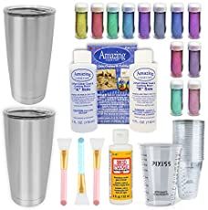 an assortment of crafting supplies including cups, scissors and other items