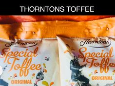 two bags of coffee sitting next to each other on top of a bed with the words thomas's special coffee