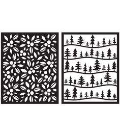 two cut outs with trees and snow on them, one is black and the other is white