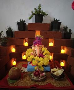 there is a gandap made out of flowers and fruit on top of the table