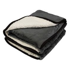 two blankets folded on top of each other with black and white trims, one in the