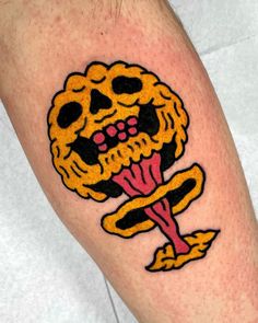 a man with a tattoo on his leg that has a skull and flower in it