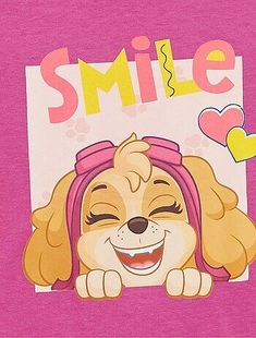 a pink t - shirt with a cartoon dog on it's chest that says smile