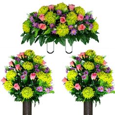 three tall vases with flowers and greenery hanging from the top, two on each side