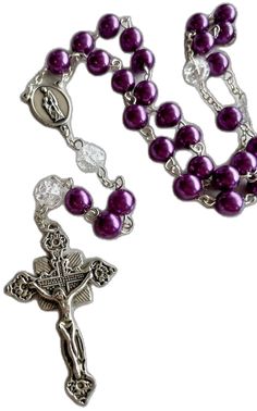 a rosary with purple beads on it