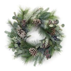 a christmas wreath with pine cones and greenery