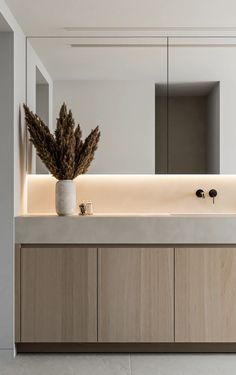 a bathroom with a large mirror and two sinks