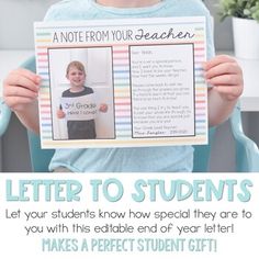 a young boy holding up a letter to students from their teacher's notebooks