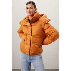 Orange nylon (100% Polyester). Puffer. Long sleeves. High neck. Front zipper fly with button closure. 23" from shoulder to hemline. Imported. Nylon Fall Outerwear With Pockets, Fall Nylon Outerwear With Detachable Hood, Fall Nylon Outerwear With Pockets, Fall Puffer Jacket With Detachable Hood, Spring Nylon Outerwear With Button Closure, Trendy Nylon Outerwear With Ribbed Cuffs, Fall Nylon Outerwear With Button Closure, Casual Fall Puffer Jacket With Detachable Hood, Nylon Outerwear With Button Closure For Outdoor