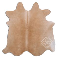 a brown cowhide rug is shown with an intricate design on the front and back