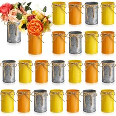 a bunch of tin cans with flowers in them