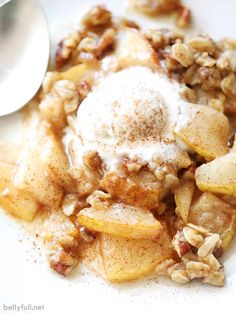 a white plate topped with apple crisp and ice cream