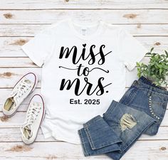 Miss To Mrs Est 2025 Shirt, Bride To Be Shirt, Newly Engaged Shirt, Bridal Shower Shirt, Mrs. Est 2025 Shirt, Mrs Shirt, Engagement Shirt  HOW TO ORDER  Simply select the color and style you would like and click proceed to checkout. From there enter in your credit card information and shipping address.  SHIPPING TIME  This is a made to order item. Production time is 1-3 days. Estimated shipping times are 3-5 business day for domestic orders. 8-10 business days for international orders.  RETURNS AND REFUNDS  I gladly accept returns and exchanges. Contact me within: 14 days of delivery. Ship items back within: 30 days of delivery.  QUESTIONS  Have a question? Click the 'Message Seller' button next to the price. I usually respond within minutes.  CUSTOM ORDER  Do you want a custom order? Send Engagement Shirts, Bridal Shower Shirts, Engagement Shirt, Engaged Shirts, Miss To Mrs, Mrs Shirt, Bride Shirts, Newly Engaged, 30 And Single