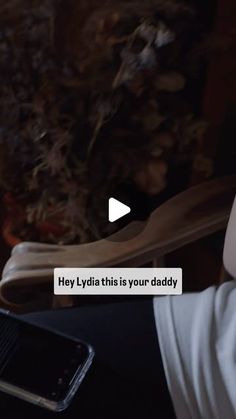 a person holding a cell phone in their hand with the text hey lydin this is your daddy