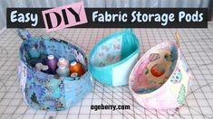 three fabric storage bags sitting on top of a cutting board with the words easy diy fabric storage pods