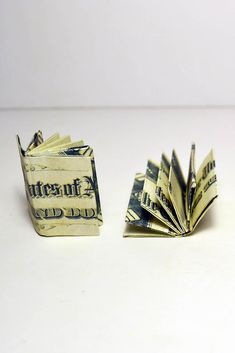 an origami dollar bill folded into a book