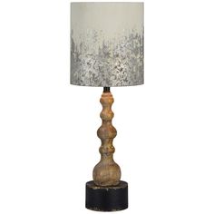 a table lamp with a white shade on it and a black base is shown in front of a white background