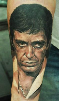 a man's arm with a portrait on it