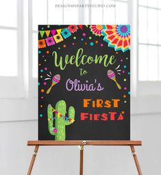 a welcome sign is on top of a easel