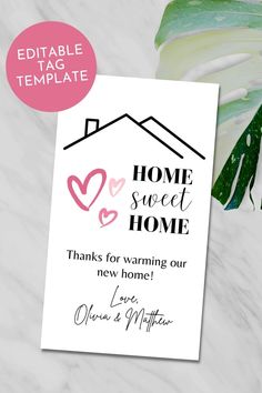 a card with the words home sweet home on it and a plant next to it